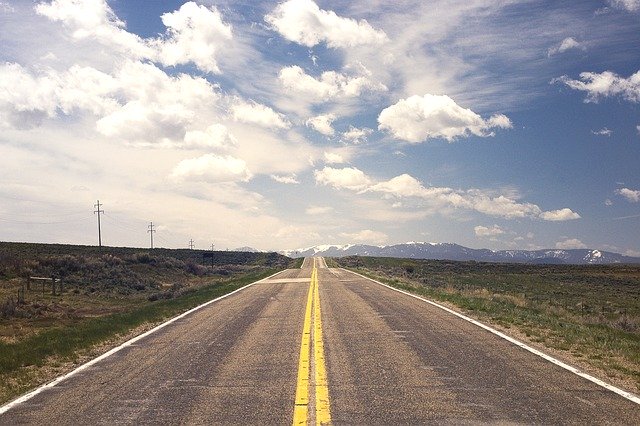a lonely road indicating a road trip
